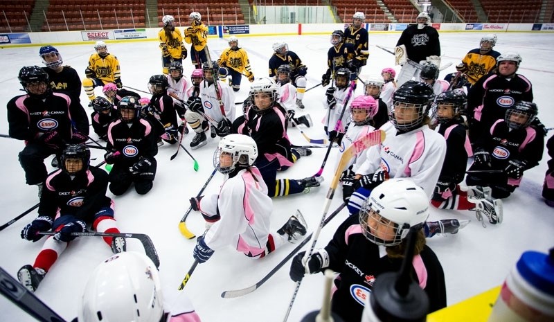 GAME ON â€“ Participants at the third annual Esso Female Hockey Fun Day in St. Albert listen to instructions at Sunday&#8217;s session at Go Auto Arena. The event featured a