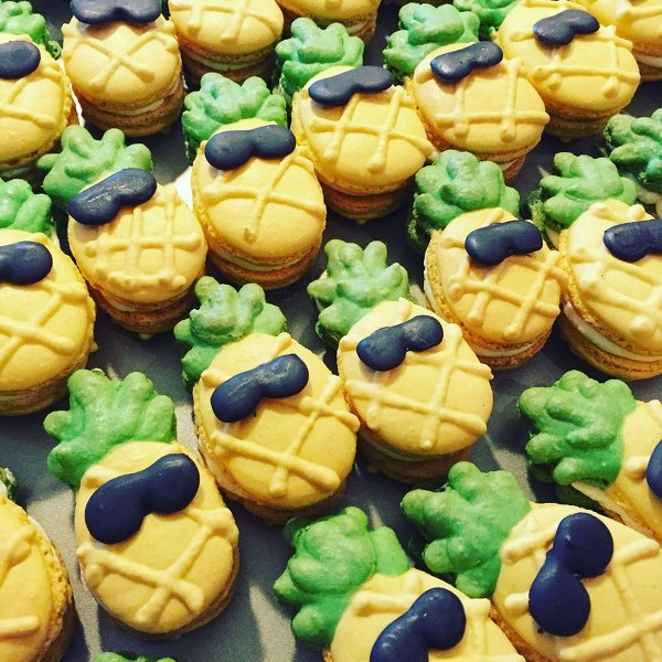 These festive looking pineapple-shaped macarons are suitably adorned with little candy sunglasses.
