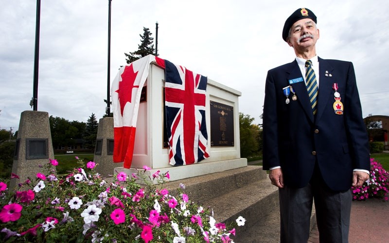 Poppy chair Doug Delorme at the cenotaph where the Sept. 11 re-dedication ceremony will commemorate the new First World War and Afghanistan plaques.