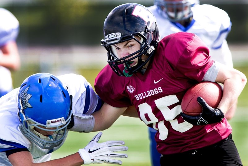 DOGGED RUNNER â€“ Nathan Brake of the junior Bellerose Bulldogs ran in a two-point conversion in Saturday&#8217;s 14-14 exhibition draw against the Peace Wapiti Academy
