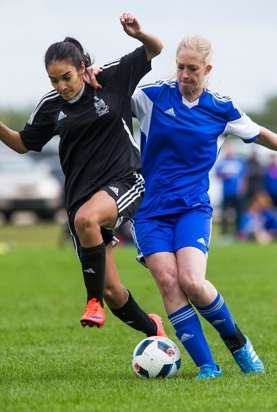 AGGRESSION â€“ Suzanne Schulz of Mavericks 09 jostles for the ball in Monday&#8217;s 2-1 loss to the KC Trojans in the Tier III provincial final at the ESA Complex. Schulz
