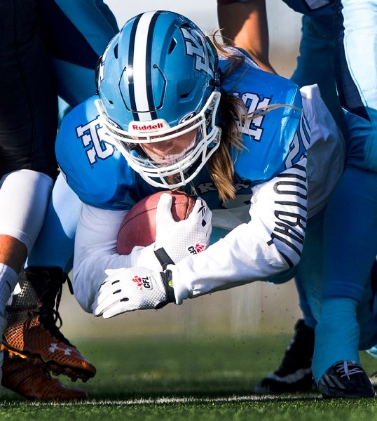 TIGHT GRIP â€“ Keaton Zaychkowsky squeezes the ball for the Paul Kane Blues in Thursday&#8217;s 24-14 loss to the Spruce Grove Panthers at Riel Recreation Park. Zaychkowsky