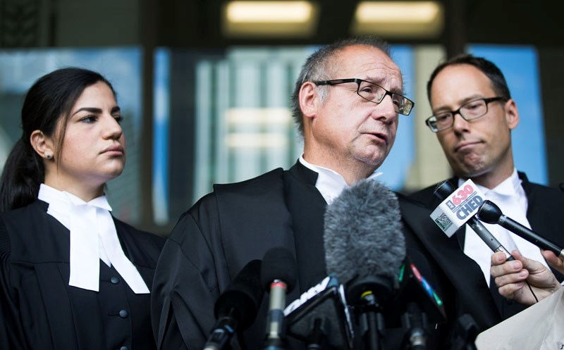 Crown Prosecutor Ashley Finlayson and his team answer questions from the media following Justice Denny Thomas&#8217; verdict in the Travis Vader murder trial at the Edmonton