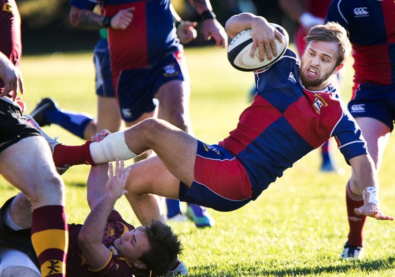 TRIPPED UP â€“ Antony Fitch of the St. Albert Rugby Football Club&#8217;s premier men&#8217;s team is upended by Jay Welsh of the Nor&#8217;Westers in the Ken Ann Cup north