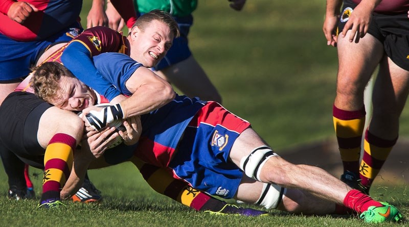 WRAPPED UP â€“ Orrin Farries of the St. Albert Rugby Football Club premier men&#8217;s team is wrestled to the pitch by Cory Billen of the Nor&#8217;Westers in the Ken Ann