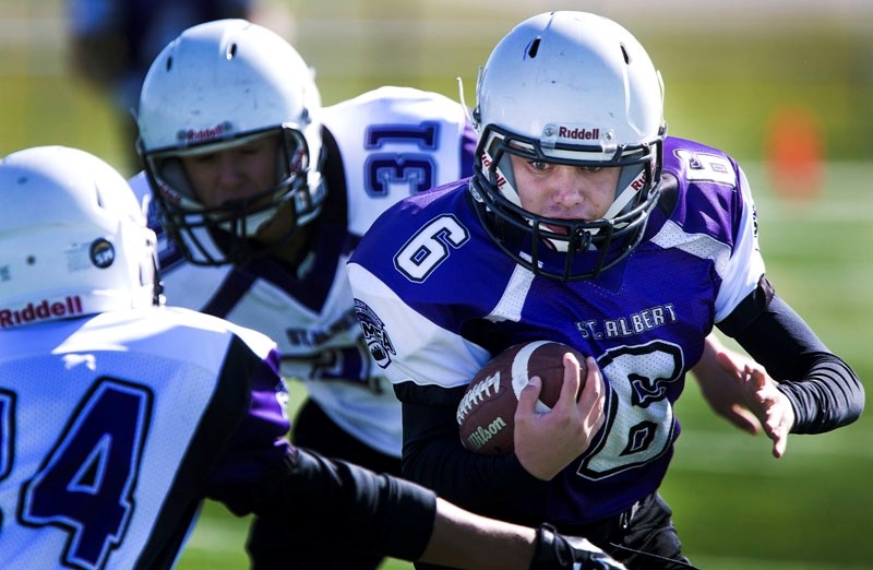LEADING THE WAY â€“ Idreese Huoseh (6) of the St. Albert Fury carries the ball while followed by Cameron Mah of the St. Albert 49ers in last weekend&#8217;s bantam game in