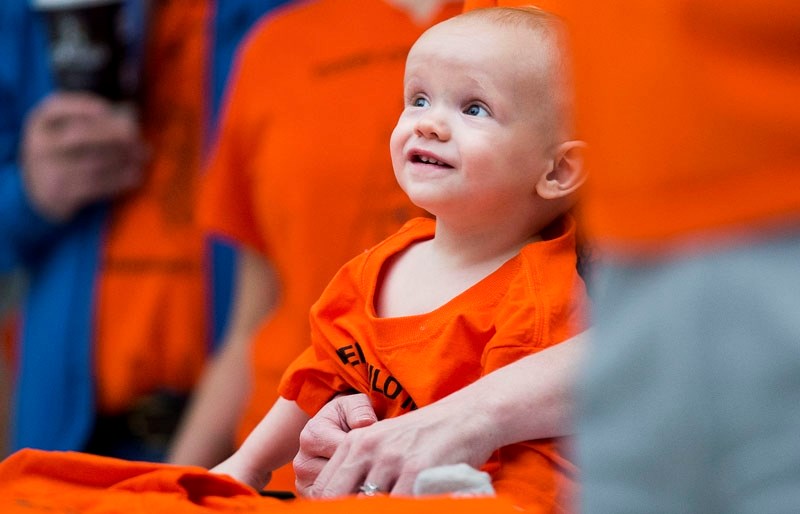 Toddler Jackson Renner looks on during the innaguration of Orange Shirt Day at Edmonton City Hall on Friday. The national campaign helps to promote awareness of residential