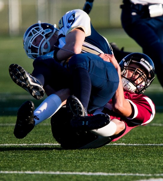 LASSOED â€“ Darryl Marsh of the Bellerose Bulldogs hauls down a St. Joseph Saint in Tuesday&#8217;s metro Edmonton junior pool B game at Riel Recreation Park. The undefeated