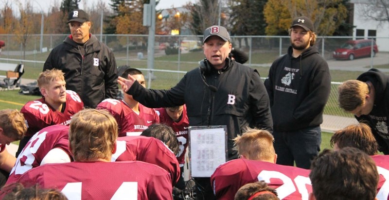 PEP TALK â€“ Head coach Chad Hill of the Bellerose Bulldogs addresses the team during halftime in Friday&#8217;s metro Edmonton game against the Jasper Place Rebels at Riel