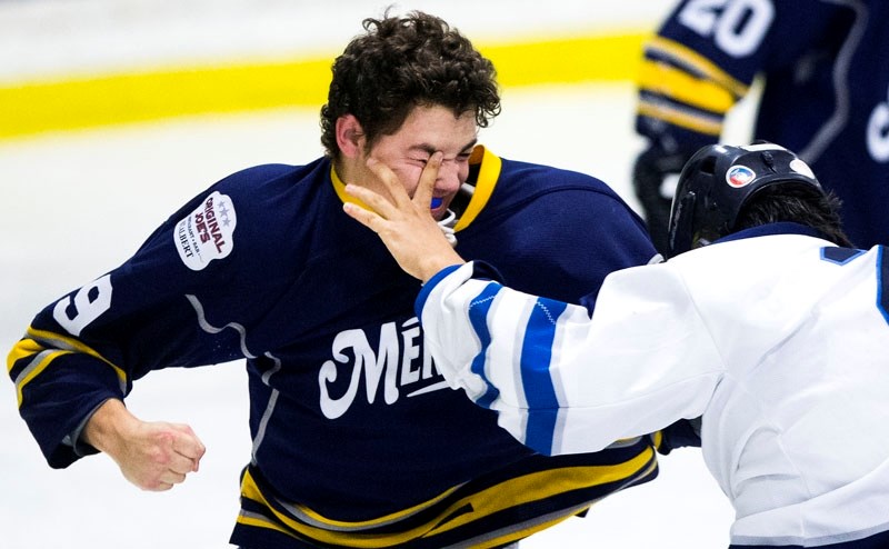 SKIRMISH â€“ Liam Mowatt of the St. Albert Merchants mixes it up with Scott Woloshyn of the Morinville Jets in the third period of Friday&#8217;s junior B tussle at Akinsdale 
