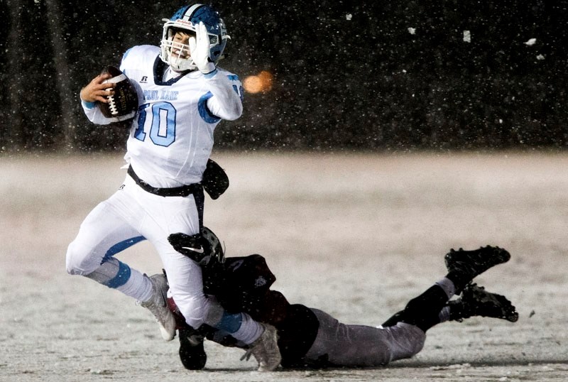 DOGGED DEFENCE â€“ Paul Kane Blues quarterback Connor Guy is tracked down by Kyle Viczko of the Bellerose Bulldogs in the Battle of St. Albert. The Bulldogs were credited