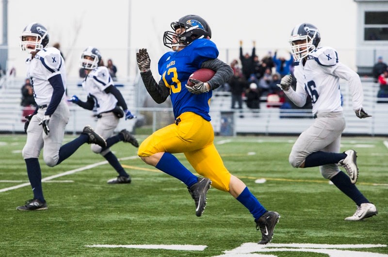 STREAKER â€“ Christian Pulis of the St. Albert High Skyhawks returns a kick-off for a touchdown in the second quarter against the St. Francis Xavier Rams but it was negated
