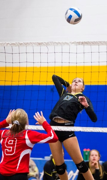 ATTACKER â€“ Jenna Ginther of the St. Albert Skyhawks lines up a spike against the Beaverlodge Royals at the 22nd annual Lions Western Canadian Challenge. The defending WCC