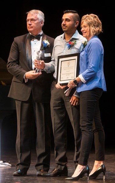 Young Entrepreneur Award winner is Gary Takhar (centre) of Rockland Landscaping Supplies. He is flanked by presenters Ken Macrae of the Chamber of Commerce and Joan Barber of 