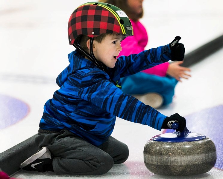 THUMBS UP â€“ Rett Billey is ready to rock at the Little Rocks beginner program Sunday afternoon at the St. Albert Curling Club. There are 31 beginner and 24 intermediate