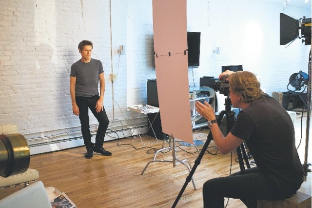 Brad Trent setting up shots in his very busy New York photo studio. Here he works with actor Willem Dafoe.