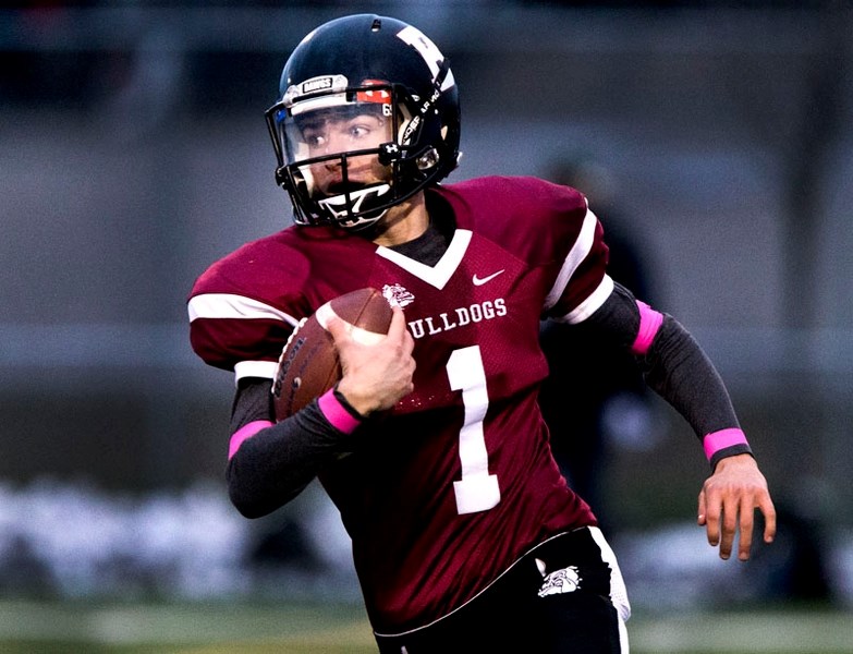 PLAYOFF RUN â€“ Benjamin Power makes tracks with the ball for the Bellerose Bulldogs in metro Edmonton high school junior football. The Bulldogs are 5-0 this year and 34-0 in 