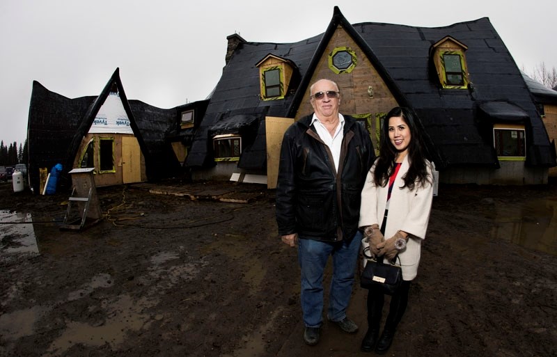 Chauvet poses with his wife Hien in front of the daycare.