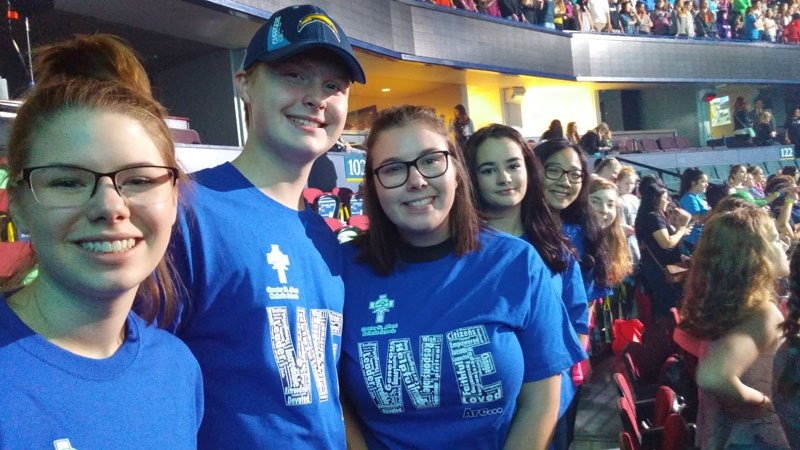 WE CELEBRATE â€“ From left to right: St. Albert Catholic High students Haley Kuchar
