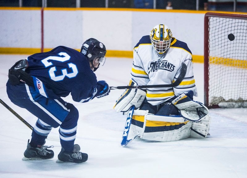 SNIPER â€“ Dylan Stang of the Morinville Jets shoots the puck past Ryen Papirny of the St. Albert Merchants in Sunday&#8217;s junior B game at Ray McDonald Sports Centre.