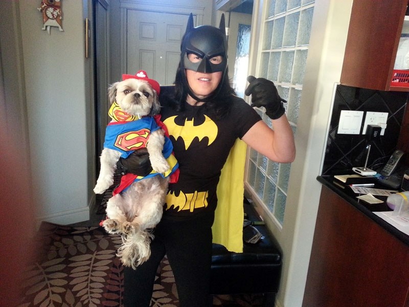 Volunteers sometimes have super human qualities. Here Batman lady and her Superman dog volunteer at the Youville Home with the Pet Therapy program.