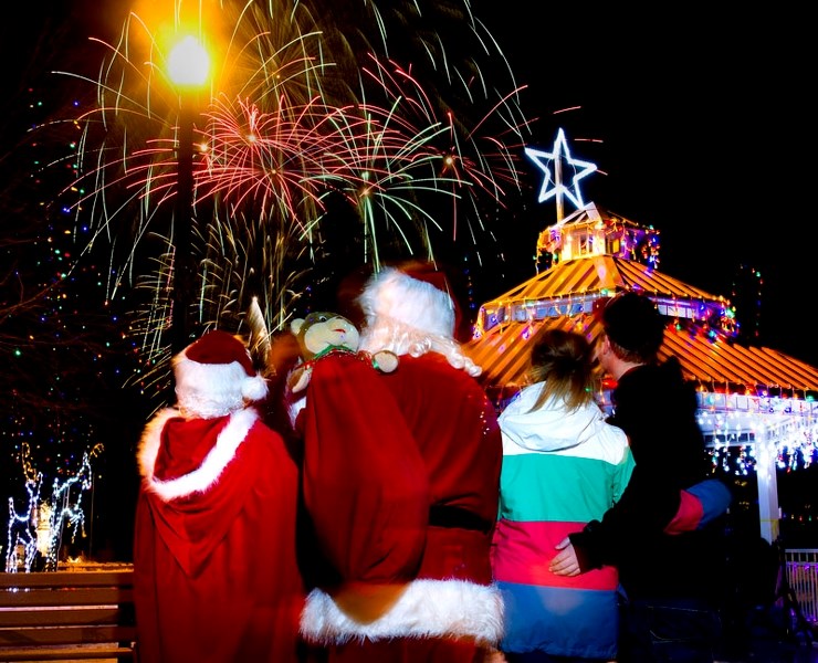 Santa and Mrs. Claus watch the fireworks display with other spectators from St. Jean Baptiste Park in Morinville for the annual Lite Up the Night Festival in Morinville.