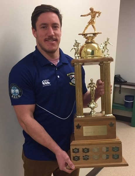 MVP â€“ Jake Robinson displays the Labatt Cup as the most valuable player in the Edmonton Rugby Union this year. The scrumhalf for the premier men&#8217;s provincial