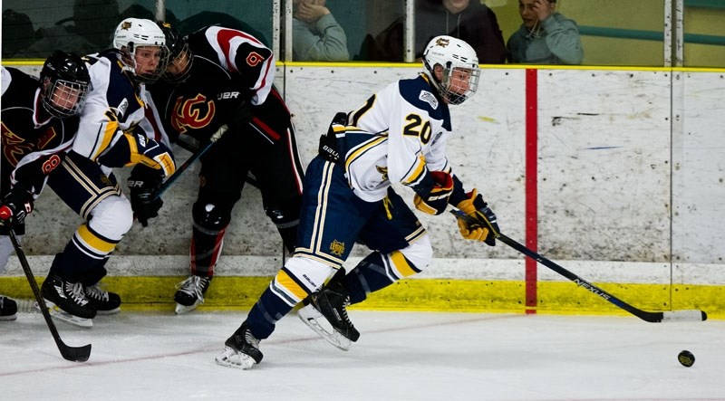BREAK OUT â€“ Tyson Kowaluk skates away with the puck for the St. Albert Gregg Distributors Sabres in the Alberta Major Bantam Hockey League. The Sabres were 14-0 before