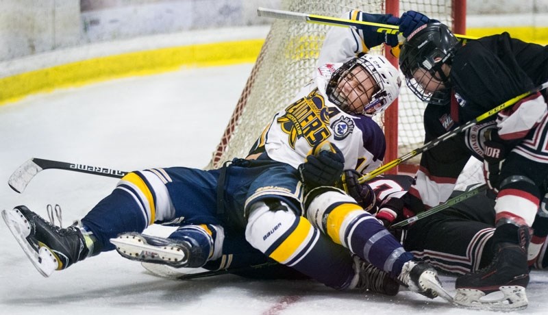 PILE-UP â€“ Austin Spiridakis of the St. Albert Gregg Distributors Sabres is tangled up by the net in Sunday&#8217;s bantam AAA game against the Calgary Bisons at Akinsdale