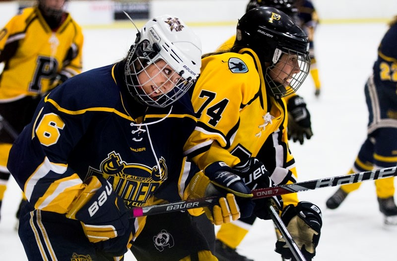 TIGHT CHECKING â€“ Jessica Kormysh of the bantam elite St. Albert Raiders keeps close taps on Sydney Monilaws of the Edmonton Pandas in last month&#8217;s 2-1 win by the