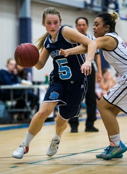 ATTACKING â€“ Teagan MacKinnon of the Paul Kane Blues works the ball past a defender in Thursday&#8217;s 63-38 win over the O&#8217;Leary Spartans at the 19th annual Mike Dea 