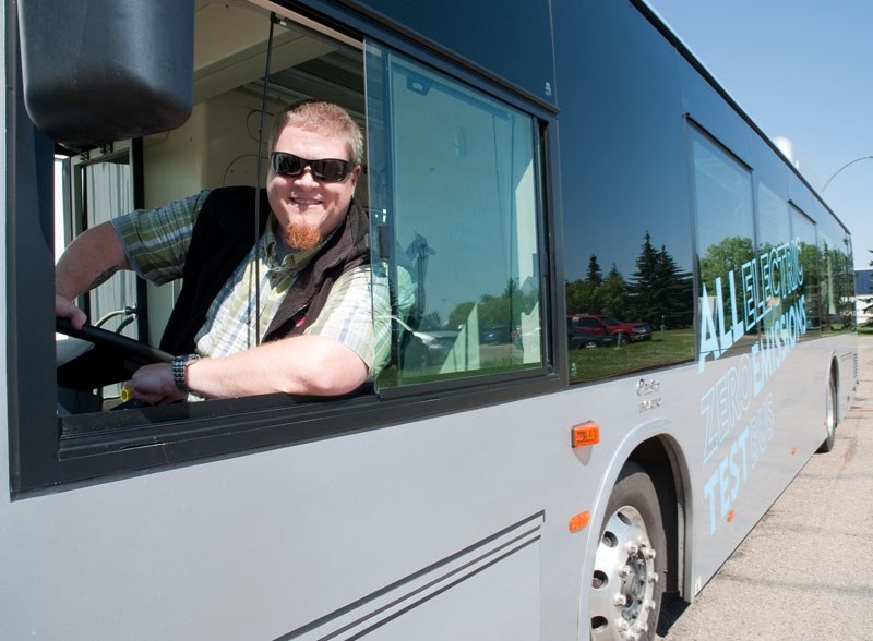 BEHIND SCHEDULE â€“ PWTransit Canada service delivery manager Morgan Smith test-drives an electric bus on loan from Edmonton in this 2014 photo. Delivery of St.