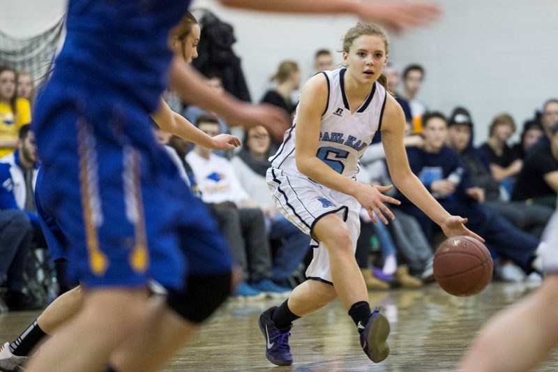 SEARCHING FOR SPACE â€“ Kaitlyn Kluttig of the Paul Kane Blues looks for a way through the defence of the St. Albert Skyhawks during Monday&#8217;s metro Edmonton division