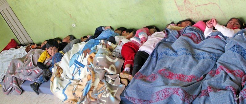 Nap time at the Cuna Jardin. These children face long days at the daycare because their mothers take them in early before going to work. A two-hour bus ride into the city