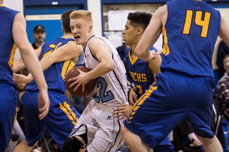 SURROUNDED â€“ Braeden Kelly of the Paul Kane Blues looks for a way out of a sea of St. Albert Skyhawks&#8217; defenders during last month&#8217;s metro Edmonton division two 