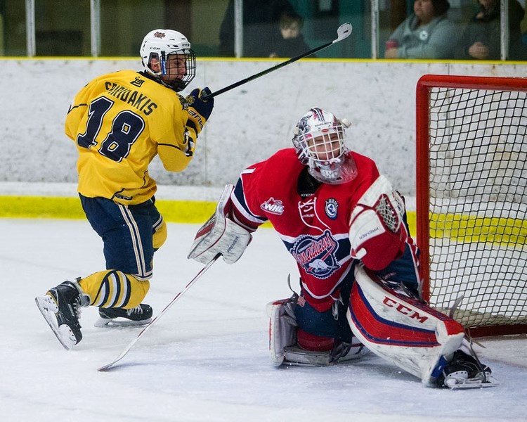 THWARTED – Austin Spiridakis of the St. Albert Gregg Distributors Sabres is unsuccessful on a breakaway against CAC Inland Cement netminder Blake Lyda during Sunday&#8217;s