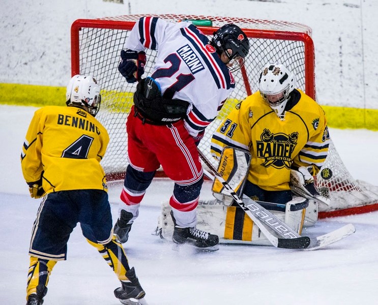 STOPPER – Nico Marini of the Yale Hockey Academy of Abbotsford is denied a goal by Kyle Nelson of the St. Albert Gregg Distributors Sabres in Friday&#8217;s game at the John