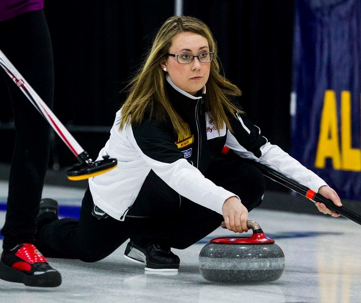 DELIVERER – Karynn Flory of St. Albert looks to make a shot at the Jiffy Lube Alberta Scotties Tournament of Hearts at the St. Albert Curling Club. The Avonair skip is
