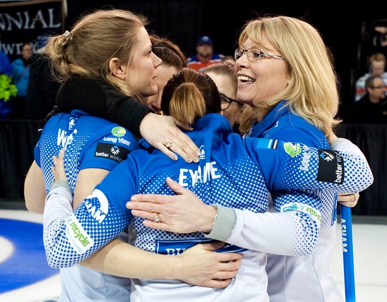 VICTORY HUG – The Shannon Kleibrink rink embrace the moment after defeating Val Sweeting 6-4 in Sunday&#8217;s final at the Jiffy Lube Alberta Scotties Tournament of Hearts