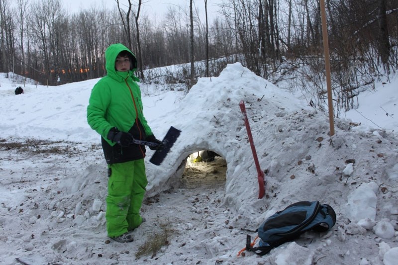 Antejus Murauskas worked hard on his makeshift home. He braved the elements and stayed warm all night inside this quinzee.