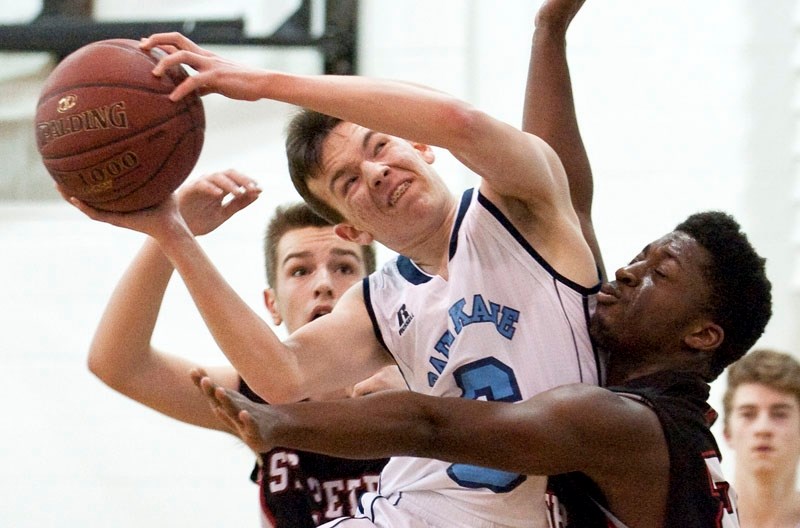 IMPACT â€“ Riley King of the Paul Kane Blues and Tega Okere of the St. Peter the Apostle Spartans collide during Thursday&#8217;s metro Edmonton division two pool A junior