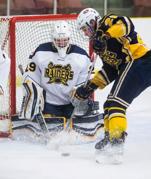 NET PROTECTOR â€“ Shane Zilka of the the St. Albert Source for Sports Crusaders guards the net against Zach Carlson of the St. Albert Blues in Monday&#8217;s midget AA