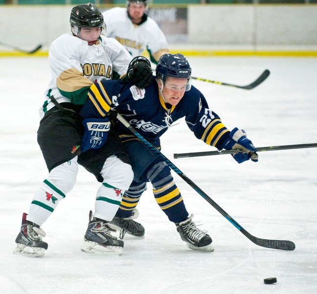 BATTLER – Liam Thomas of the St. Albert Merchants muscles his way past a defender in Sunday&#8217;s junior B game against the Edmonton Royals at Akinsdale Arena. Thomas