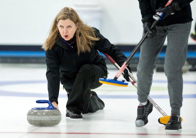 SENIOR SKIPPER â€“ Deb Santos delivers a stone during a practice session at the St. Albert Curling Club. The Santos rink of third Teri Tralnberg
