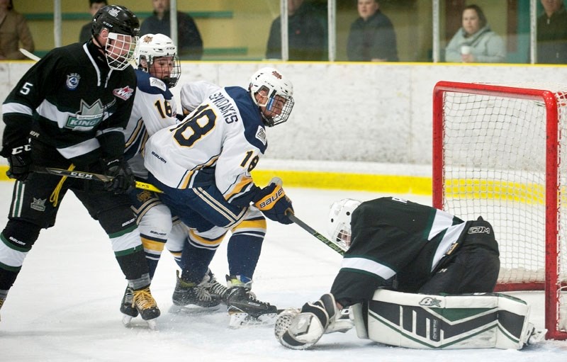 SEARCHING TO SCORE â€“ Austin Spiridakis and Ethan Whillans of the St. Albert Gregg Distributors Sabres look for a rebound as netminder Brady Roblin of the Sherwood Park