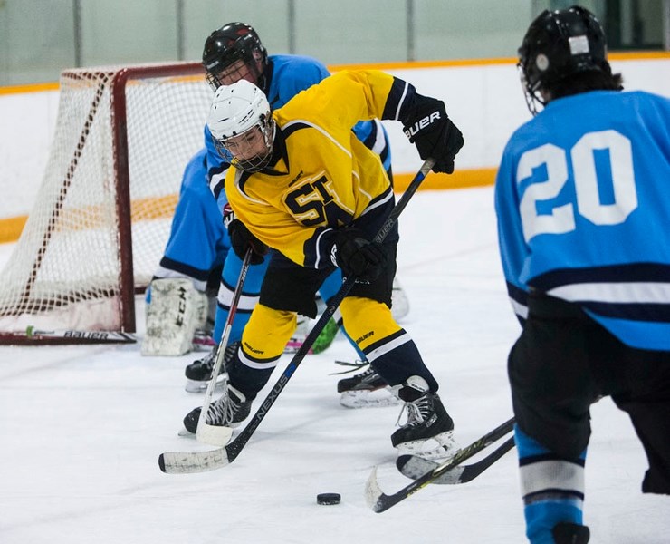 ZONING IN â€“ Shayne Letendre of the midget 4A St. Albert Flyers tracks down the puck in the offensive zone against the Airdrie Avalanche in Saturday&#8217;s game at the