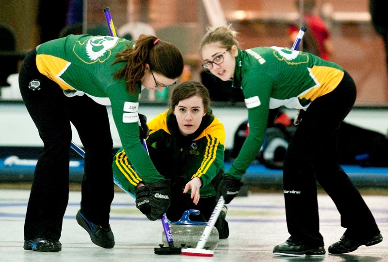 SKIP&#8217;S SHOT – Abby Marks of the U18 Alberta Pandas delivers a rock for Jamie Scott