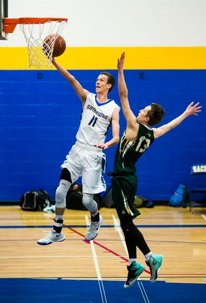 LAYUP â€“ Tylar Dobish of the St. Albert Skyhawks soars to the hoop in Monday&#8217;s metro Edmonton division two senior men&#8217;s opening playoff match against the