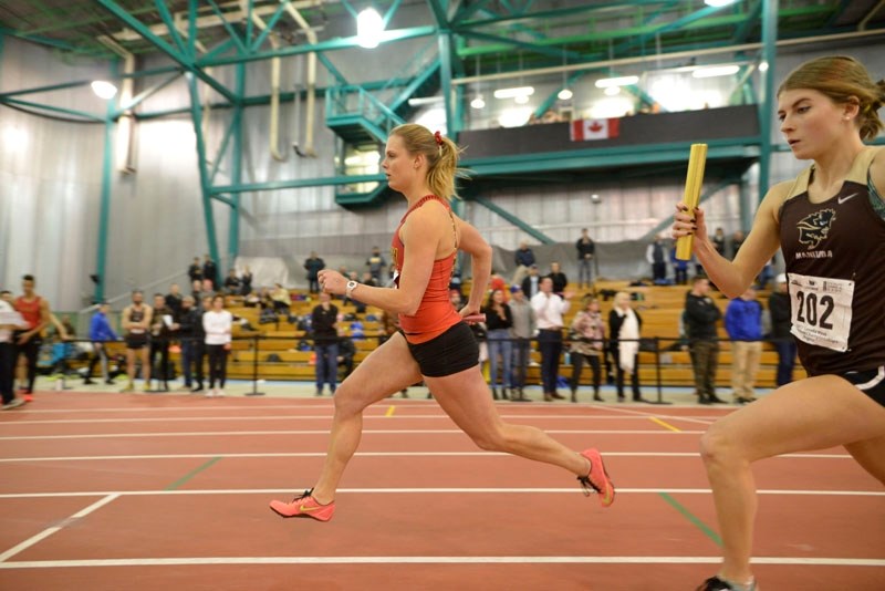STANDOUT – Niki Oudenaarden of St. Albert runs the second leg of the 4&#215;400 metre relay for the gold-medal winning Calgary Dinos at the Canada West championships last