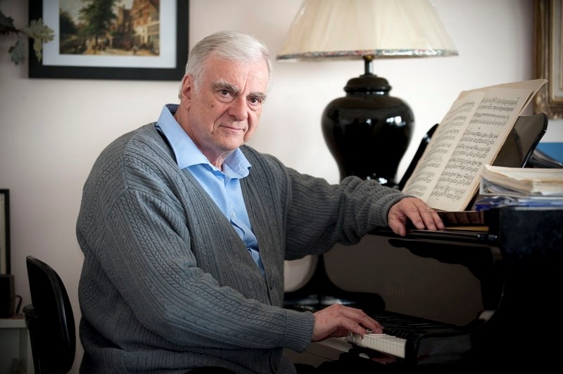 Michael Massey on his grand piano in the studio of his home in St. Albert.